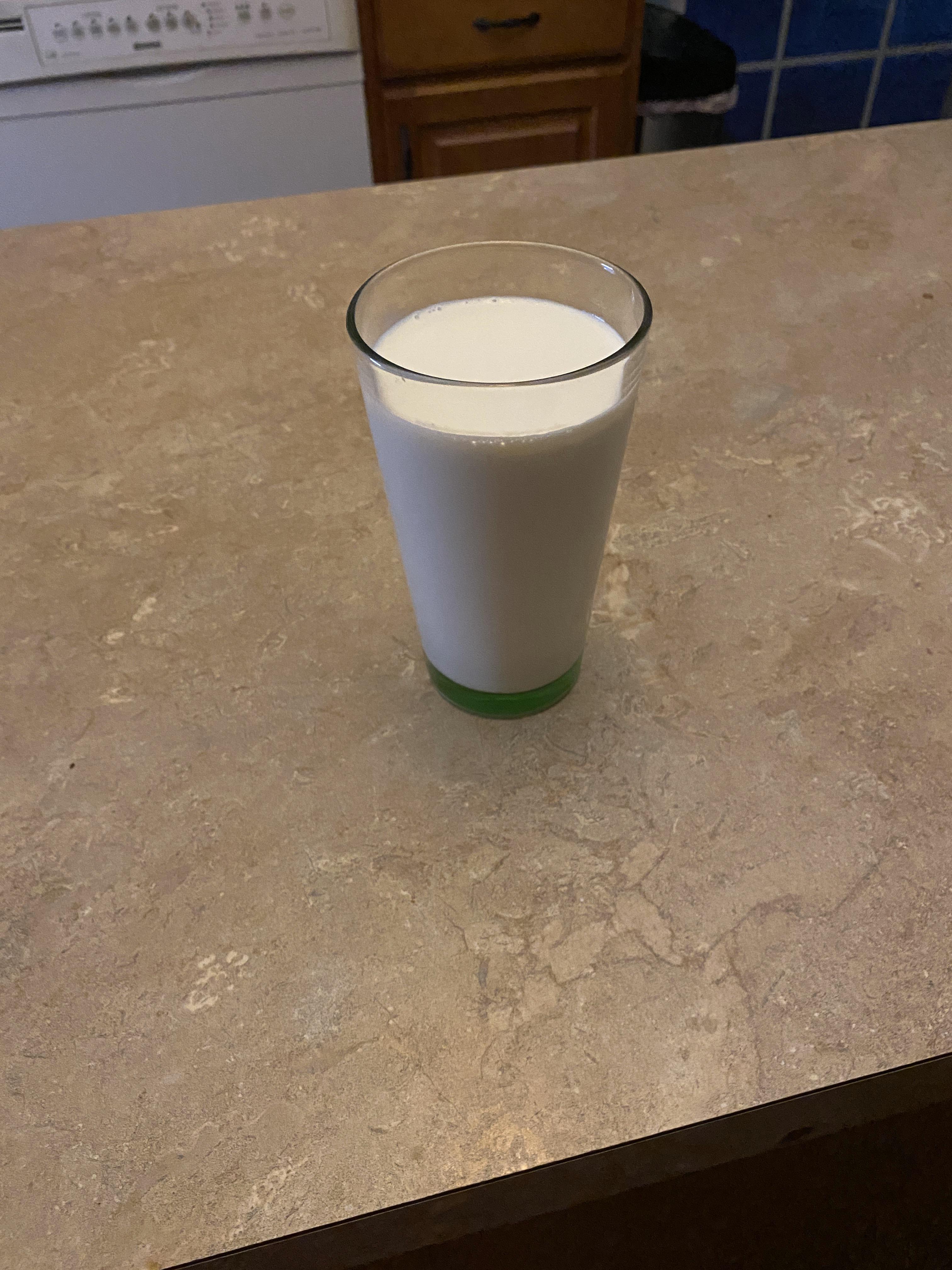 Glass of milk under kitchen light